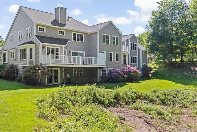 70 Humphreys Ln Unit 70, Duxbury, MA 02332 - back of house with a wooden deck, a yard, a chimney, and a shingled roof