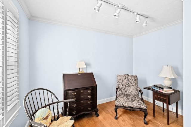 70 Humphreys Ln Unit 70, Duxbury, MA 02332 - living area with ornamental molding, wood finished floors, baseboards, and rail lighting