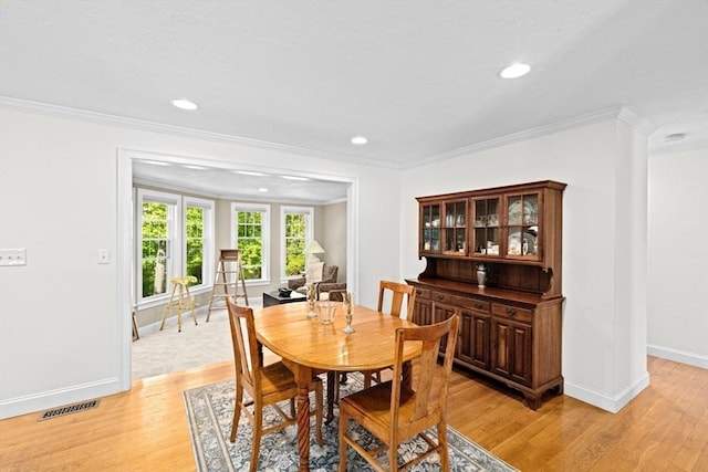 70 Humphreys Ln Unit 70, Duxbury, MA 02332 - dining space with light wood-type flooring, crown molding, baseboards, and recessed lighting