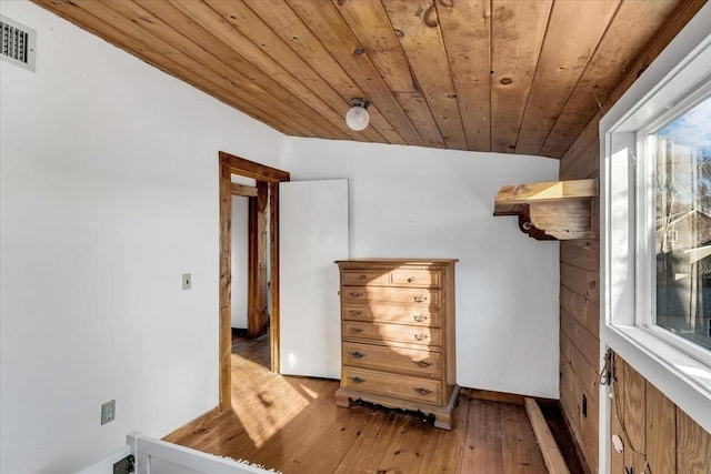 interior space with wooden ceiling and light hardwood / wood-style flooring