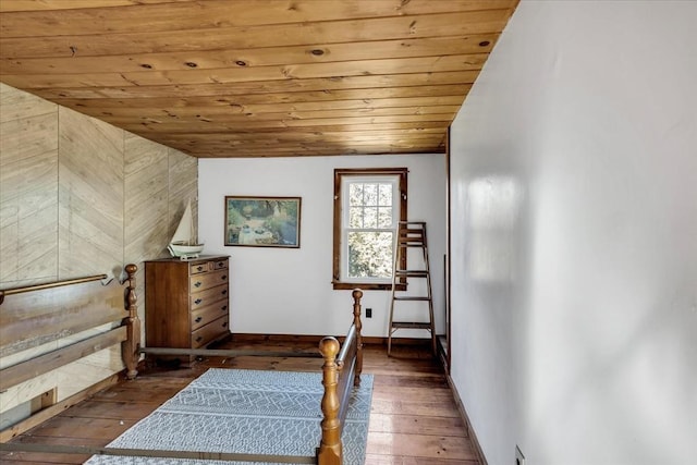 unfurnished bedroom with wooden ceiling, dark wood-type flooring, and vaulted ceiling