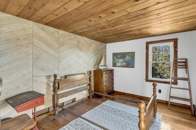 bedroom featuring wood ceiling and wood-type flooring