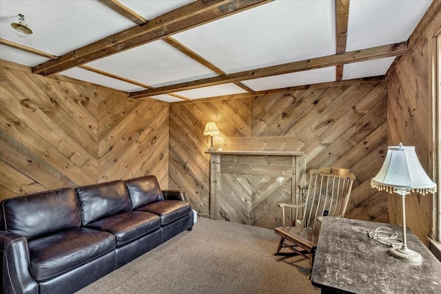 living room featuring beam ceiling, wood walls, and carpet flooring