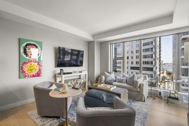 133 Seaport Blvd Unit 716, Boston, MA 02210 - living room featuring wood finished floors and baseboards