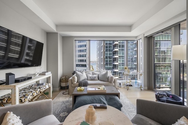 133 Seaport Blvd Unit 716, Boston, MA 02210 - living area with plenty of natural light, wood finished floors, and baseboards