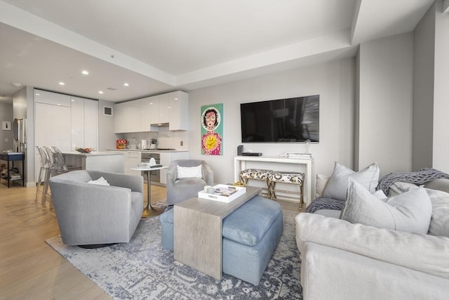 133 Seaport Blvd Unit 716, Boston, MA 02210 - living room with recessed lighting and light wood-type flooring
