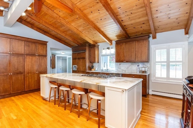 115 Lincoln Rd, Walpole, MA 02081 - kitchen featuring wood ceiling, stainless steel gas cooktop, baseboard heating, light wood-type flooring, and vaulted ceiling with beams
