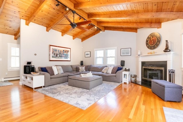 115 Lincoln Rd, Walpole, MA 02081 - living room with wooden ceiling, baseboard heating, a healthy amount of sunlight, and light wood-style floors