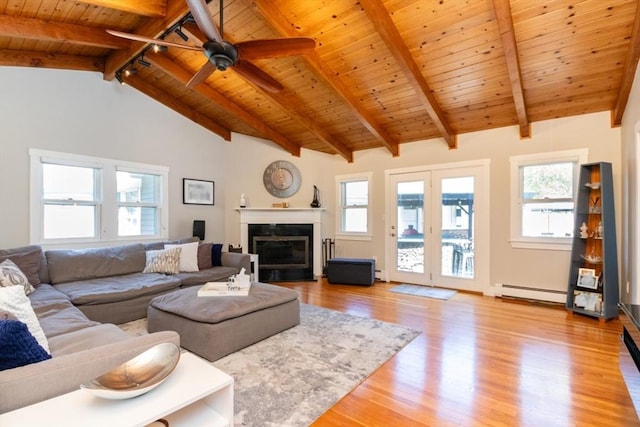 115 Lincoln Rd, Walpole, MA 02081 - living area featuring a baseboard heating unit, a healthy amount of sunlight, wood ceiling, and light wood-style flooring