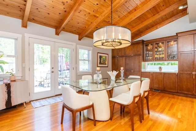115 Lincoln Rd, Walpole, MA 02081 - dining area with vaulted ceiling with beams, plenty of natural light, wooden ceiling, french doors, and light wood-style flooring