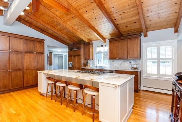 115 Lincoln Rd, Walpole, MA 02081 - kitchen featuring a baseboard radiator, vaulted ceiling with beams, stainless steel gas stovetop, light wood-type flooring, and wood ceiling