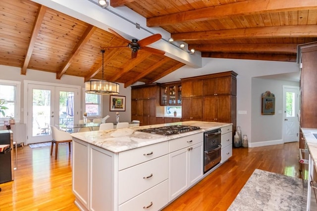 115 Lincoln Rd, Walpole, MA 02081 - kitchen with lofted ceiling with beams, wooden ceiling, stainless steel gas cooktop, and light wood-style flooring