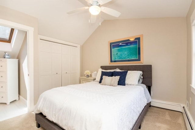115 Lincoln Rd, Walpole, MA 02081 - bedroom with a ceiling fan, a baseboard radiator, a baseboard heating unit, lofted ceiling with skylight, and a closet