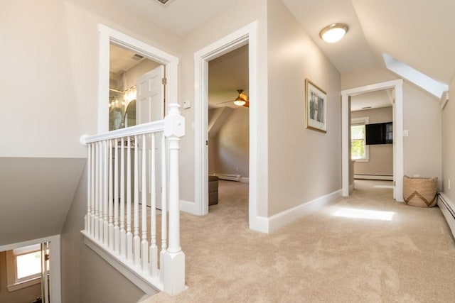 115 Lincoln Rd, Walpole, MA 02081 - hallway with carpet floors, an upstairs landing, plenty of natural light, and baseboard heating