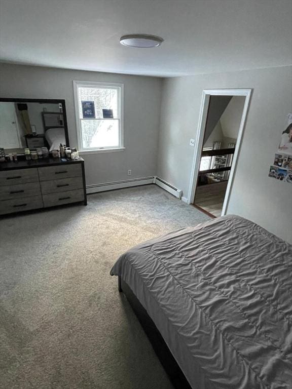 carpeted bedroom with baseboard heating