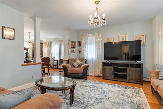 living room featuring ornate columns, a notable chandelier, and a baseboard heating unit