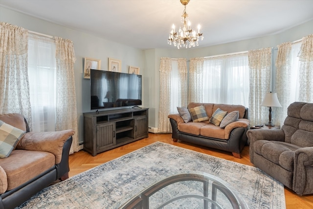 living room featuring light parquet flooring, an inviting chandelier, and baseboard heating