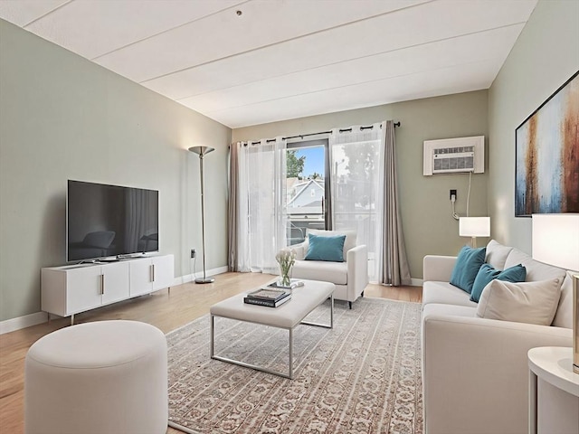 881 Broadway Unit 16, Everett, MA 02149 - living room with wood finished floors and an AC wall unit