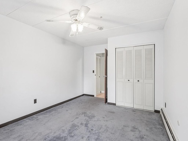 881 Broadway Unit 16, Everett, MA 02149 - unfurnished bedroom featuring a baseboard radiator, carpet flooring, a closet, and a ceiling fan