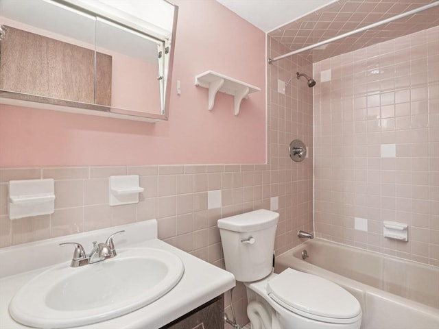 881 Broadway Unit 16, Everett, MA 02149 - full bath with bathing tub / shower combination, vanity, tile walls, and wainscoting