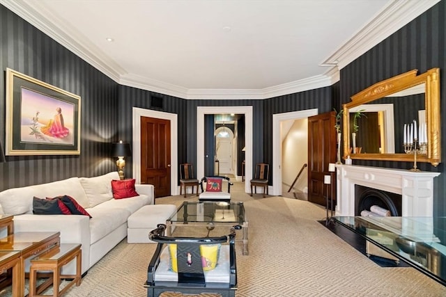 living area with ornamental molding, a fireplace, and wallpapered walls