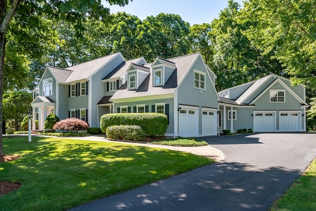 view of front of home featuring a front yard and a garage