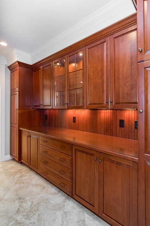 interior space with crown molding