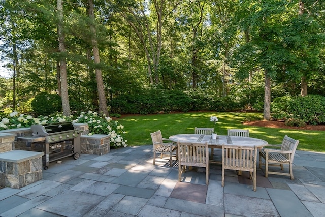 view of patio featuring a grill