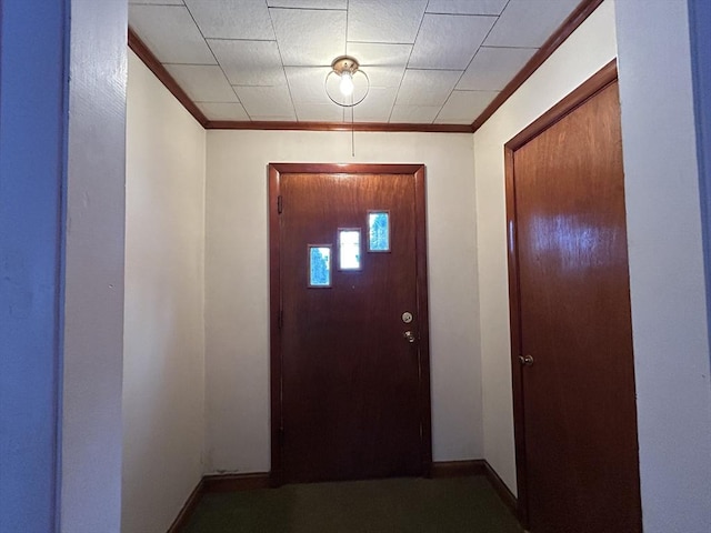 entryway featuring crown molding