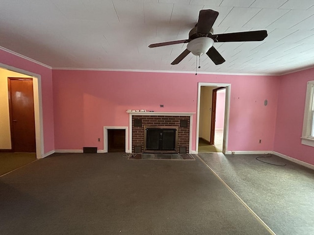 unfurnished living room featuring crown molding, ceiling fan, and a fireplace