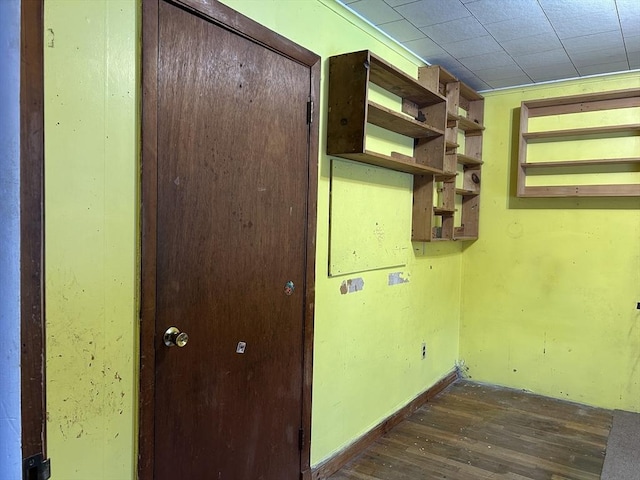 washroom with dark wood-type flooring