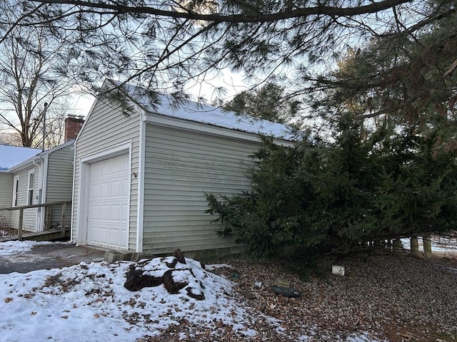 view of snow covered garage