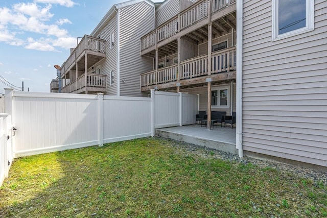 view of yard with a patio area and a fenced backyard