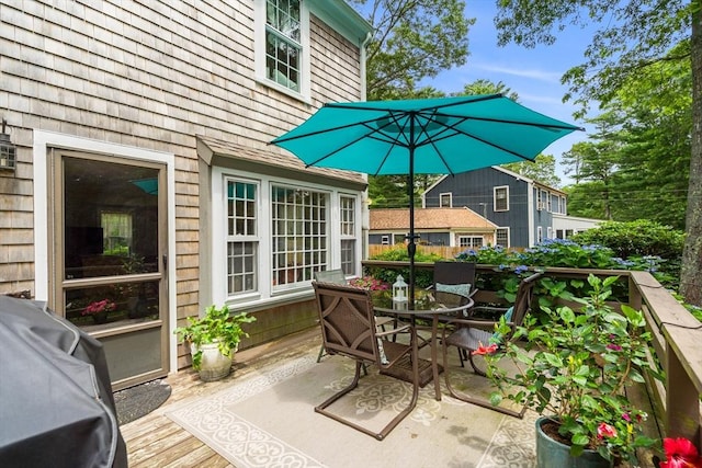 exterior space with grilling area and a wooden deck