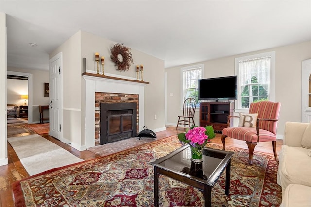 living room featuring a fireplace and hardwood / wood-style floors