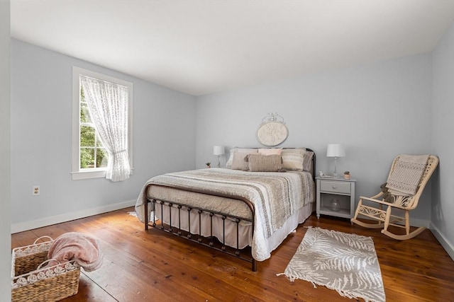 bedroom with hardwood / wood-style floors