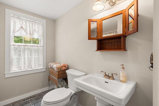 bathroom featuring toilet and sink