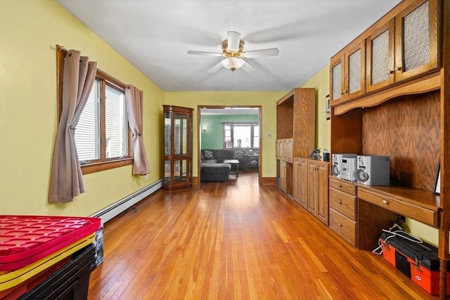 23 Essex St, Revere, MA 02151 - bedroom with a baseboard radiator and light wood-style flooring