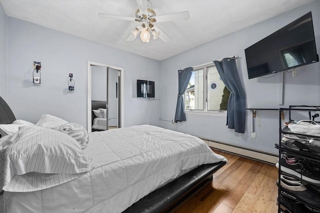 23 Essex St, Revere, MA 02151 - bedroom featuring a baseboard heating unit, hardwood / wood-style floors, and a ceiling fan