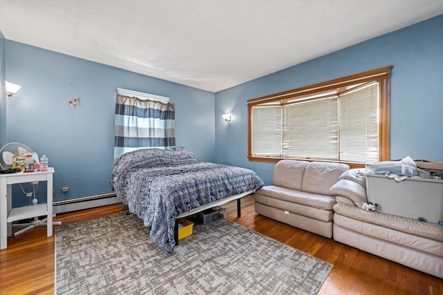 23 Essex St, Revere, MA 02151 - bedroom featuring wood finished floors and baseboard heating