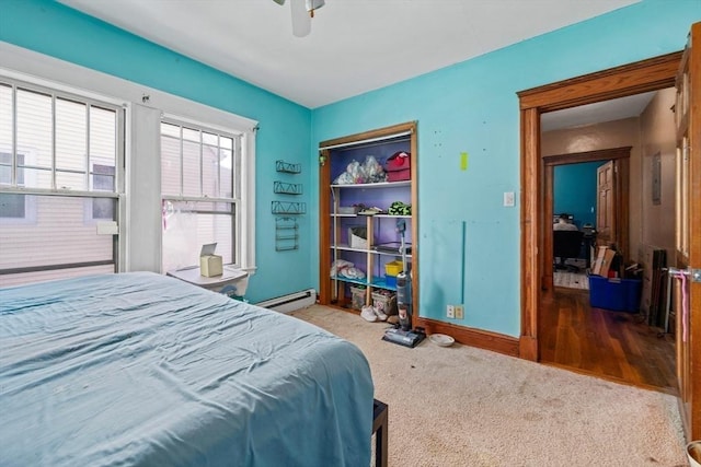23 Essex St, Revere, MA 02151 - bedroom featuring a baseboard heating unit, radiator, and ceiling fan