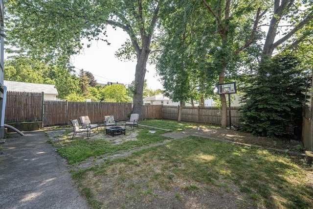 23 Essex St, Revere, MA 02151 - fenced backyard featuring an outdoor fire pit