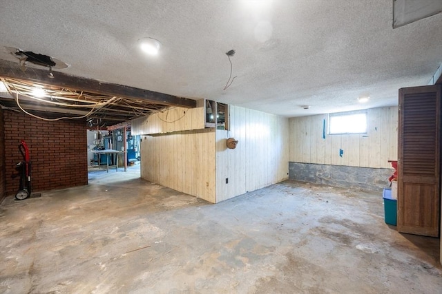 23 Essex St, Revere, MA 02151 - basement featuring a textured ceiling and wood walls