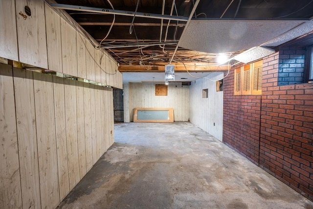 23 Essex St, Revere, MA 02151 - unfinished below grade area featuring brick wall and wooden walls