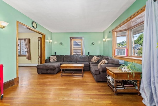 23 Essex St, Revere, MA 02151 - living room with light wood-type flooring, baseboard heating, and cooling unit