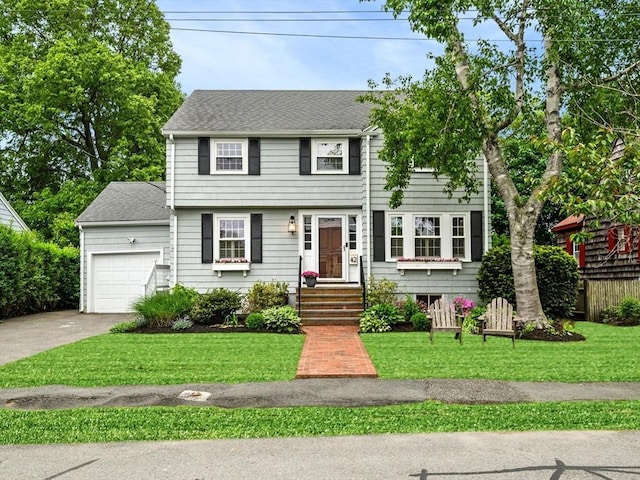 42 Pickwick Rd, Marblehead, MA 01945 - colonial house featuring an attached garage, a front lawn, and concrete driveway