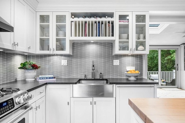 42 Pickwick Rd, Marblehead, MA 01945 - kitchen with a sink, wall chimney exhaust hood, backsplash, white cabinets, and glass insert cabinets