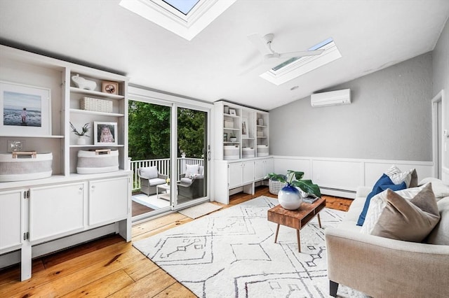 42 Pickwick Rd, Marblehead, MA 01945 - living room featuring a skylight, baseboard heating, a wall mounted air conditioner, vaulted ceiling, and light wood-style flooring