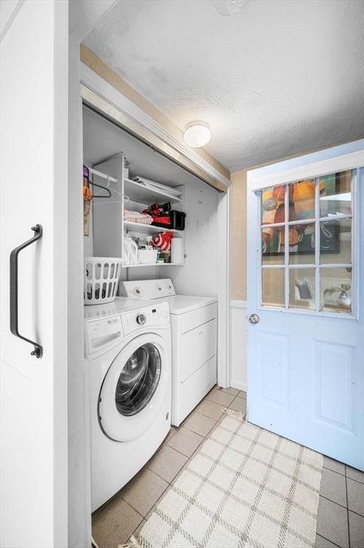 42 Pickwick Rd, Marblehead, MA 01945 - laundry room with washing machine and dryer and light tile patterned flooring