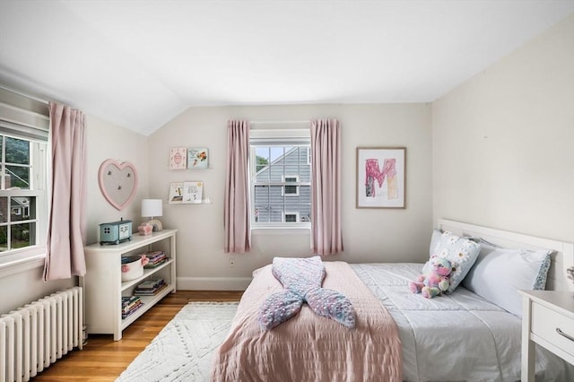 42 Pickwick Rd, Marblehead, MA 01945 - bedroom with radiator heating unit, light wood-type flooring, lofted ceiling, and baseboards